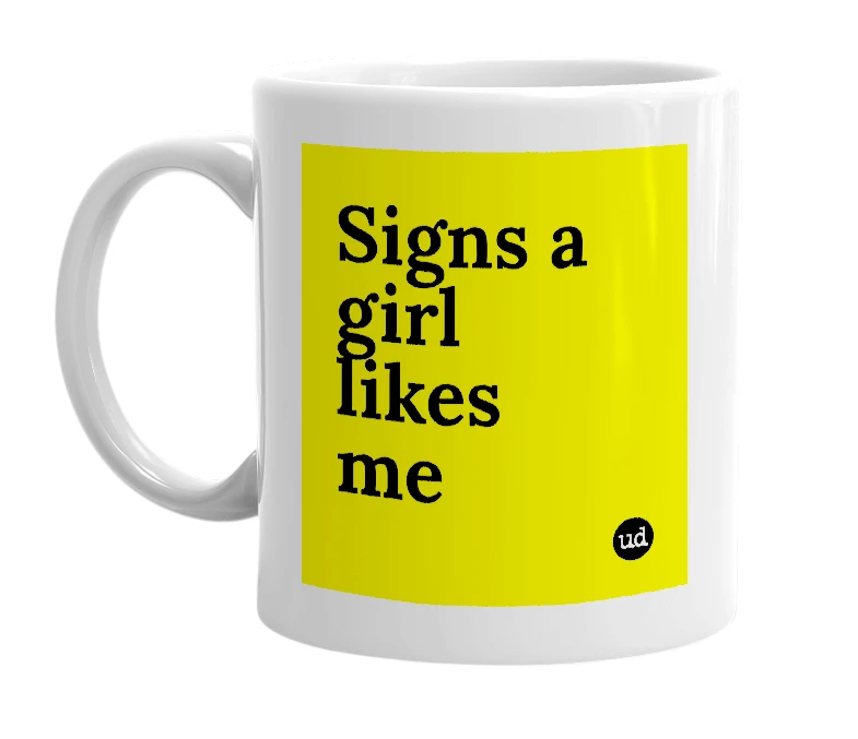 White mug with 'Signs a girl likes me' in bold black letters