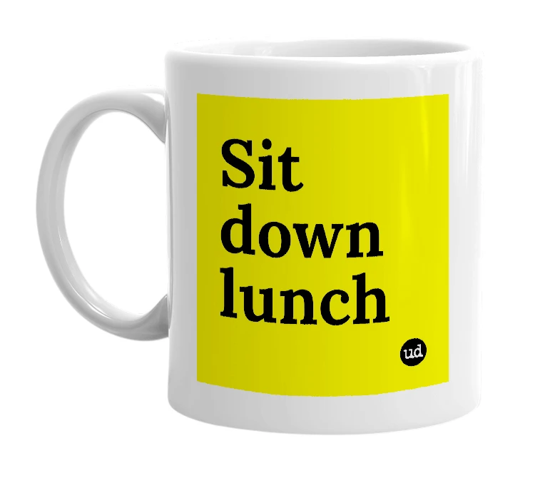 White mug with 'Sit down lunch' in bold black letters