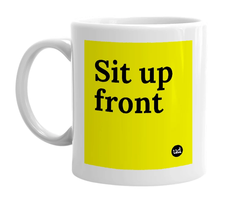 White mug with 'Sit up front' in bold black letters