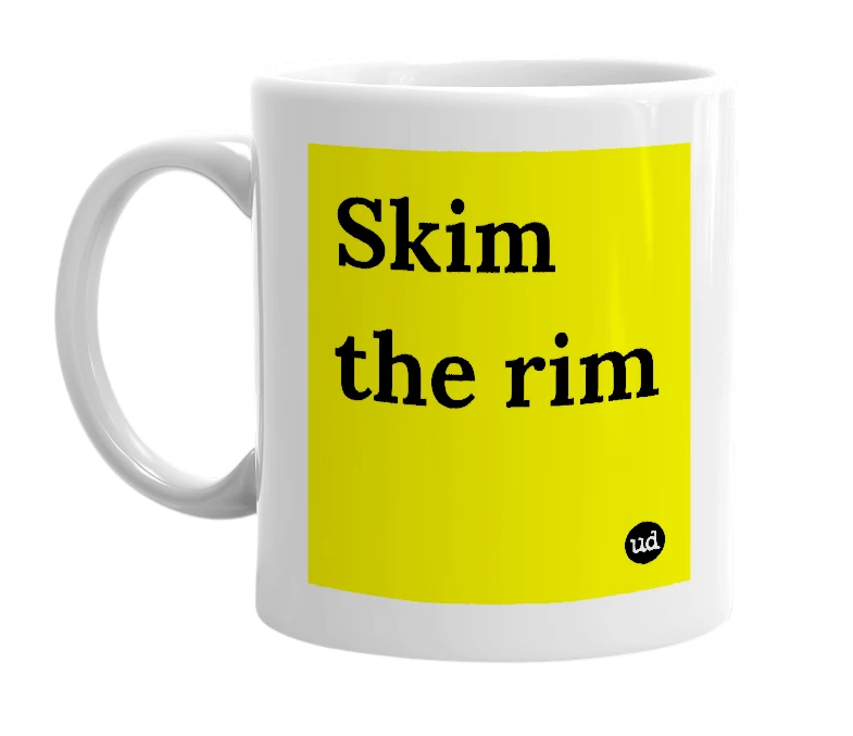 White mug with 'Skim the rim' in bold black letters