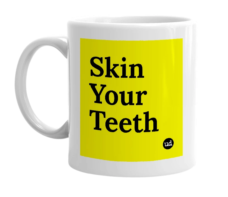 White mug with 'Skin Your Teeth' in bold black letters