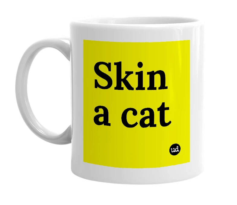 White mug with 'Skin a cat' in bold black letters