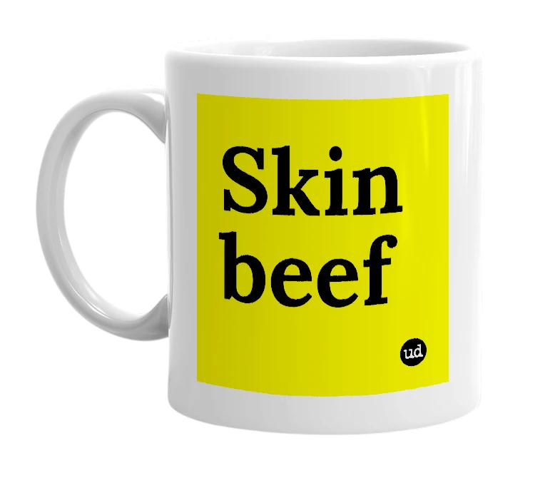 White mug with 'Skin beef' in bold black letters