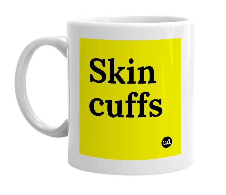 White mug with 'Skin cuffs' in bold black letters
