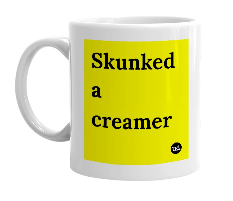 White mug with 'Skunked a creamer' in bold black letters
