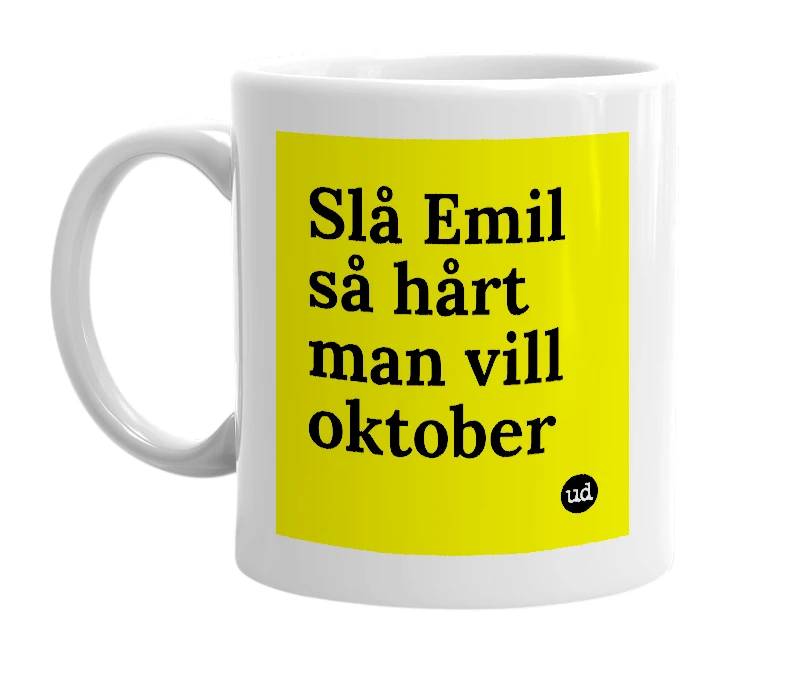 White mug with 'Slå Emil så hårt man vill oktober' in bold black letters