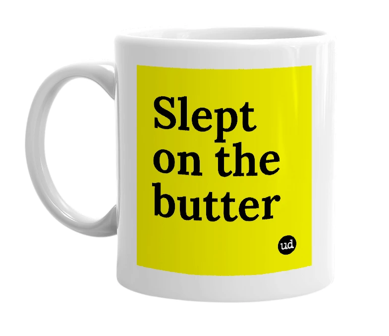 White mug with 'Slept on the butter' in bold black letters