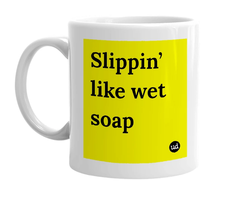 White mug with 'Slippin’ like wet soap' in bold black letters