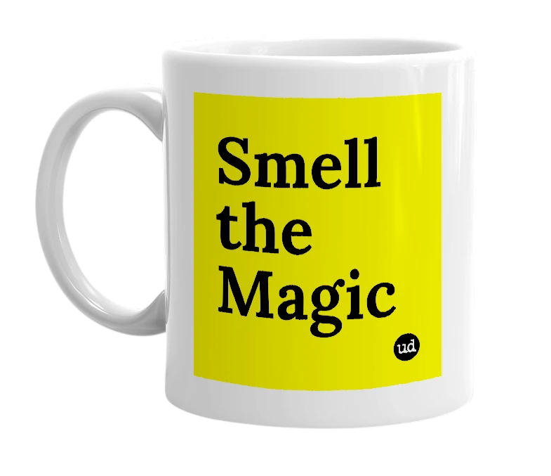 White mug with 'Smell the Magic' in bold black letters