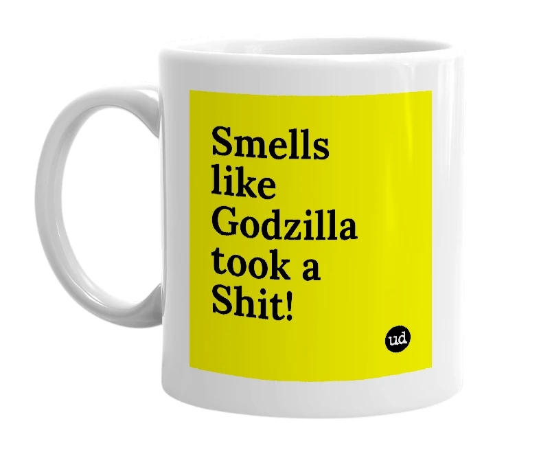 White mug with 'Smells like Godzilla took a Shit!' in bold black letters