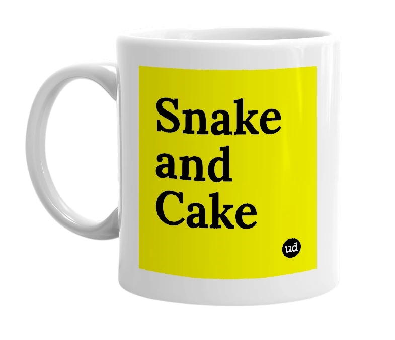 White mug with 'Snake and Cake' in bold black letters