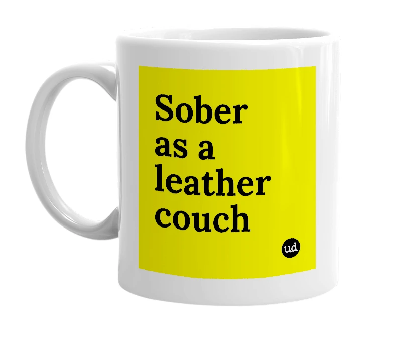 White mug with 'Sober as a leather couch' in bold black letters