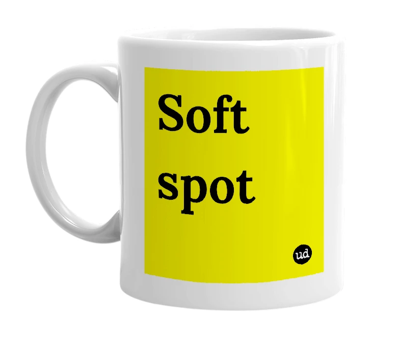 White mug with 'Soft spot' in bold black letters