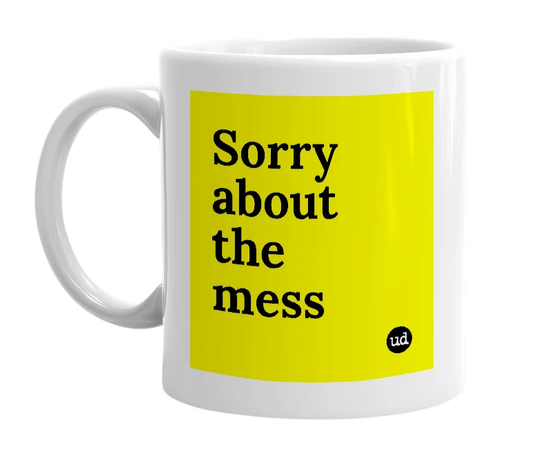 White mug with 'Sorry about the mess' in bold black letters