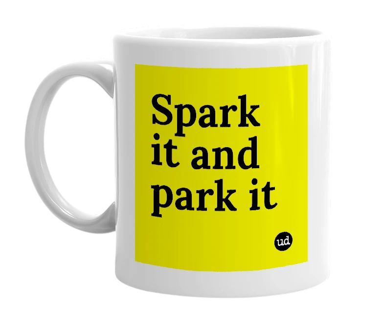 White mug with 'Spark it and park it' in bold black letters