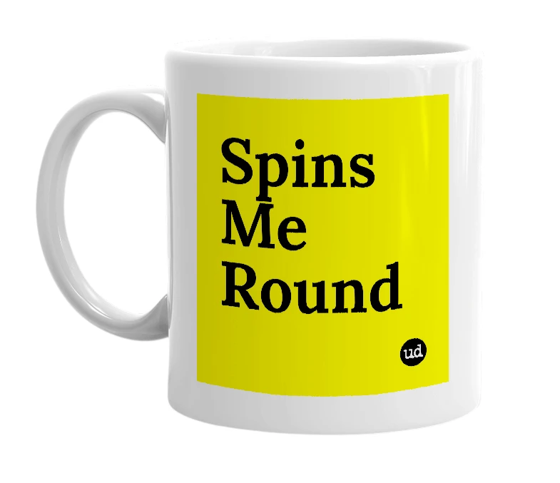 White mug with 'Spins Me Round' in bold black letters