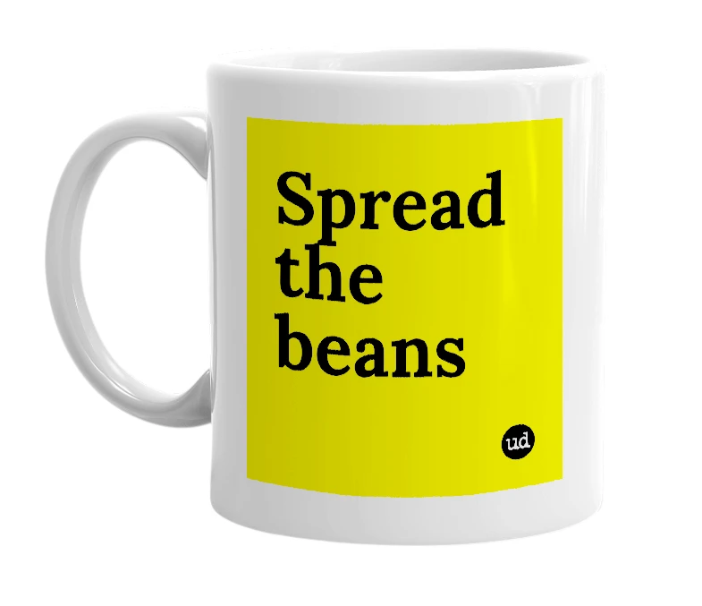 White mug with 'Spread the beans' in bold black letters