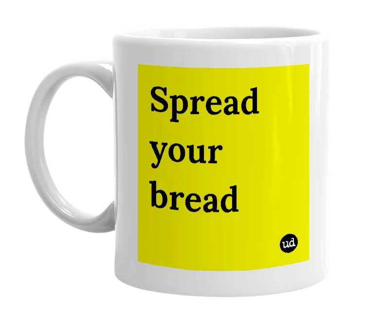 White mug with 'Spread your bread' in bold black letters