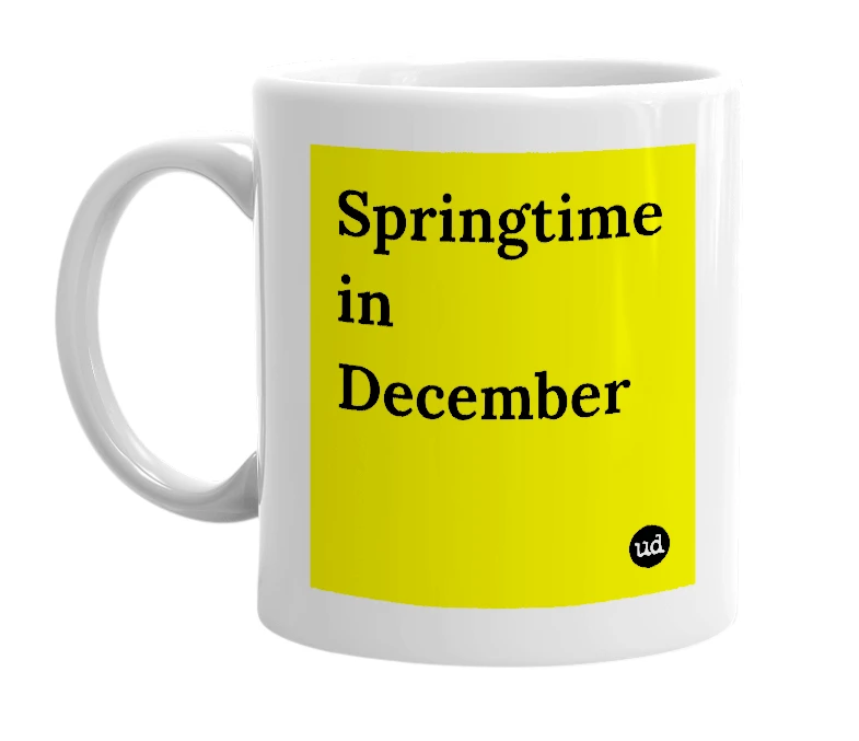 White mug with 'Springtime in December' in bold black letters