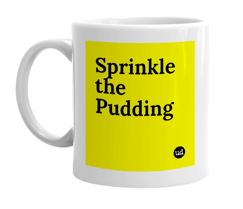 White mug with 'Sprinkle the Pudding' in bold black letters