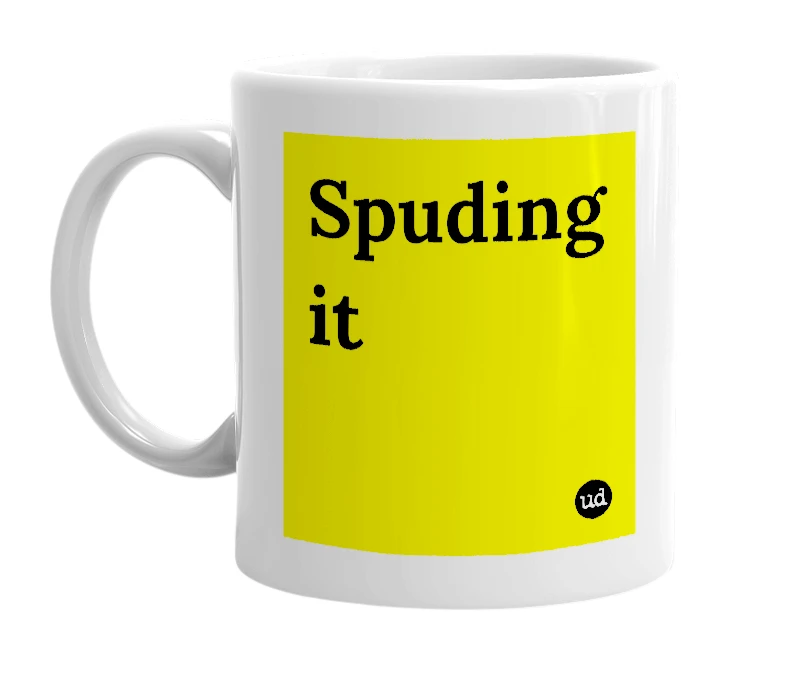 White mug with 'Spuding it' in bold black letters
