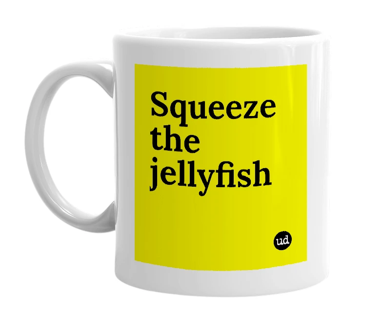 White mug with 'Squeeze the jellyfish' in bold black letters