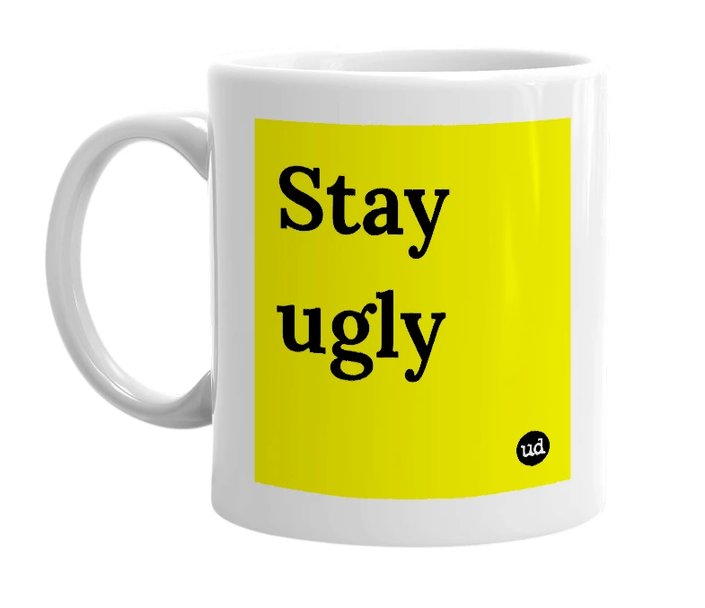 White mug with 'Stay ugly' in bold black letters