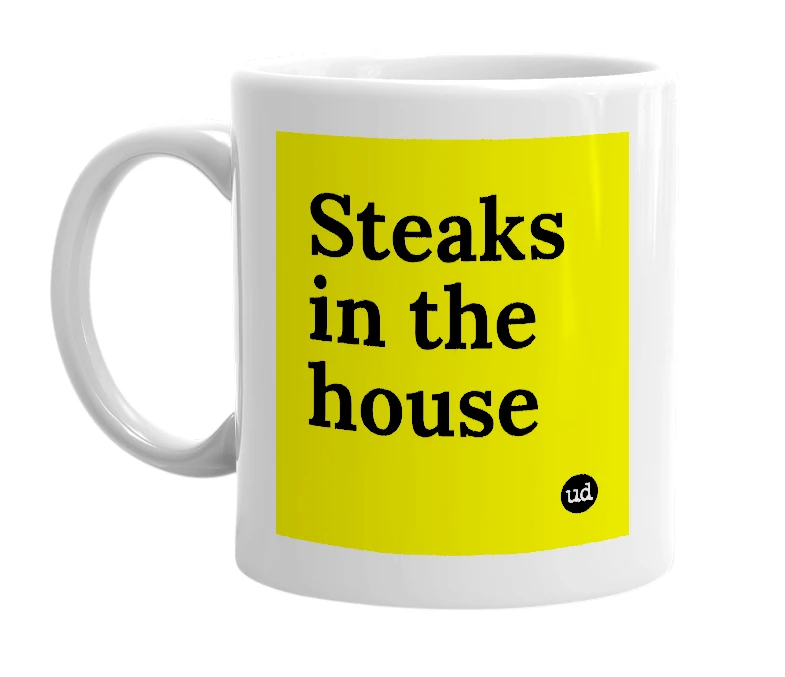 White mug with 'Steaks in the house' in bold black letters