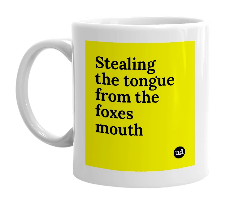 White mug with 'Stealing the tongue from the foxes mouth' in bold black letters