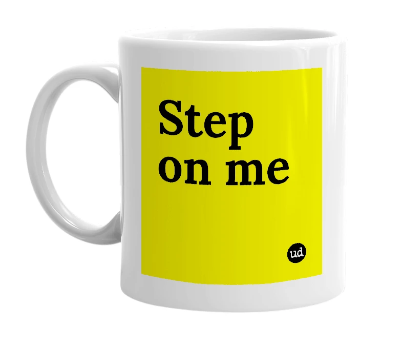 White mug with 'Step on me' in bold black letters