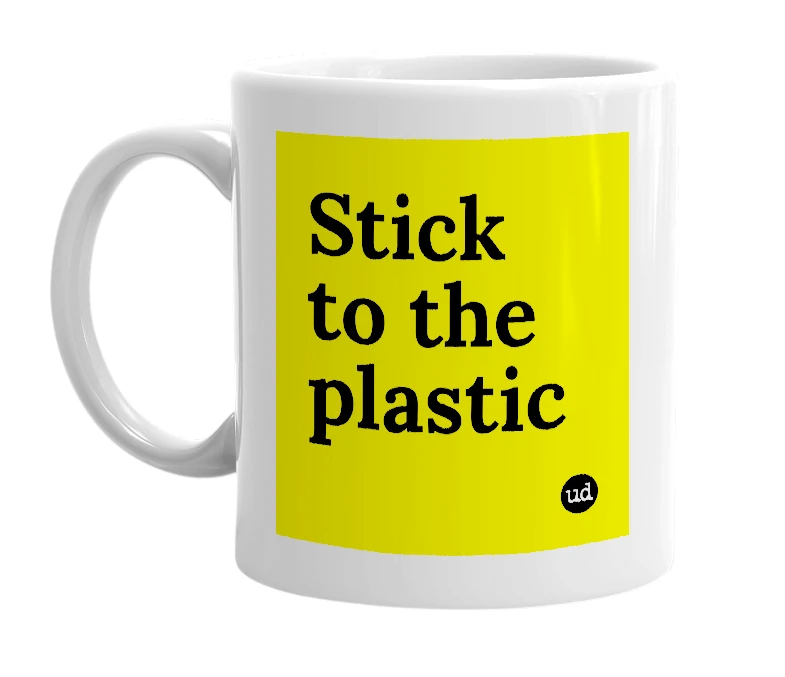 White mug with 'Stick to the plastic' in bold black letters