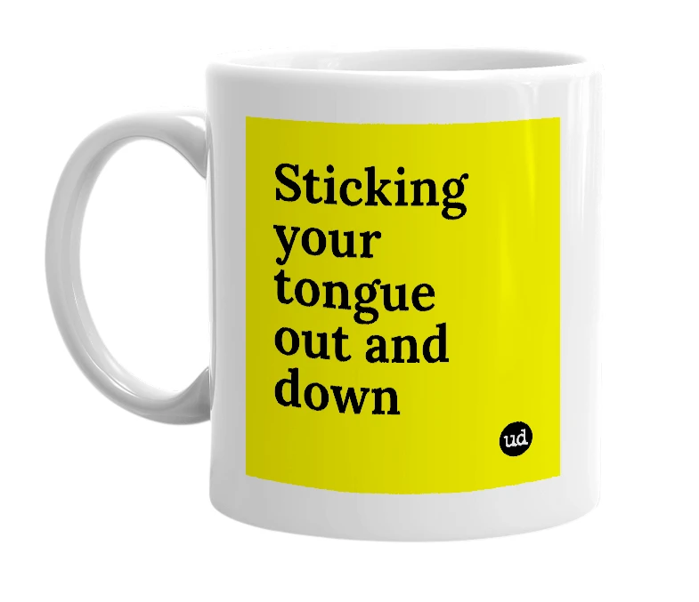 White mug with 'Sticking your tongue out and down' in bold black letters