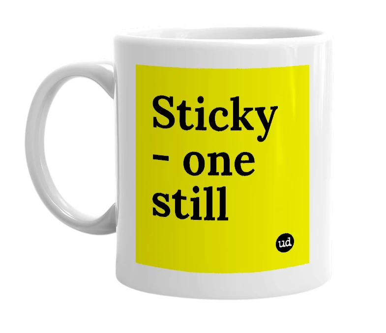 White mug with 'Sticky - one still' in bold black letters