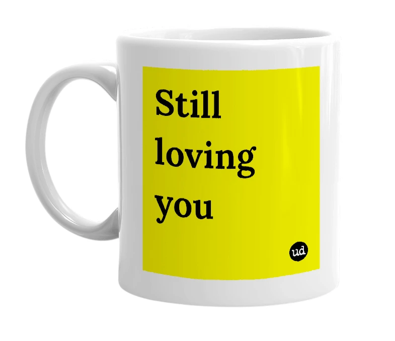 White mug with 'Still loving you' in bold black letters