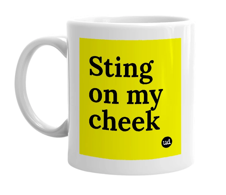 White mug with 'Sting on my cheek' in bold black letters
