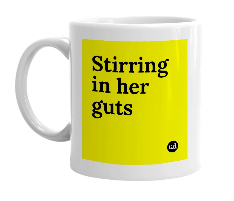 White mug with 'Stirring in her guts' in bold black letters