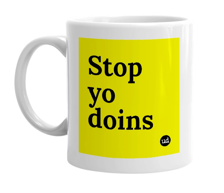 White mug with 'Stop yo doins' in bold black letters