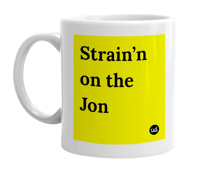 White mug with 'Strain’n on the Jon' in bold black letters