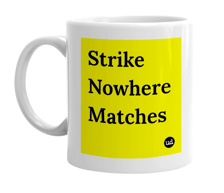 White mug with 'Strike Nowhere Matches' in bold black letters