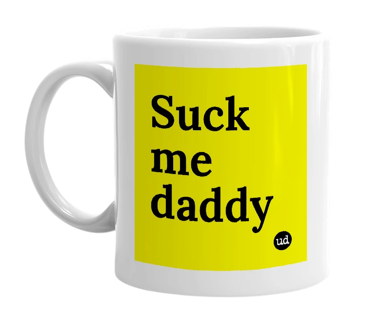 White mug with 'Suck me daddy' in bold black letters