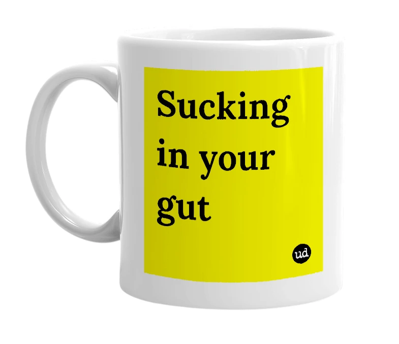 White mug with 'Sucking in your gut' in bold black letters