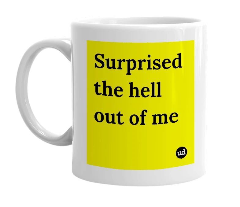 White mug with 'Surprised the hell out of me' in bold black letters