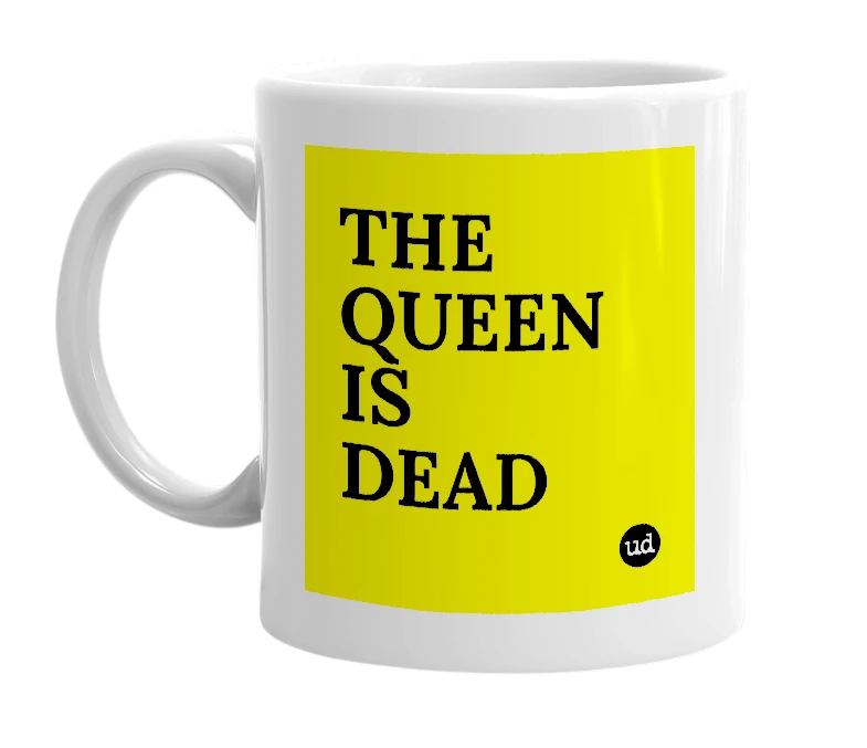 White mug with 'THE QUEEN IS DEAD' in bold black letters