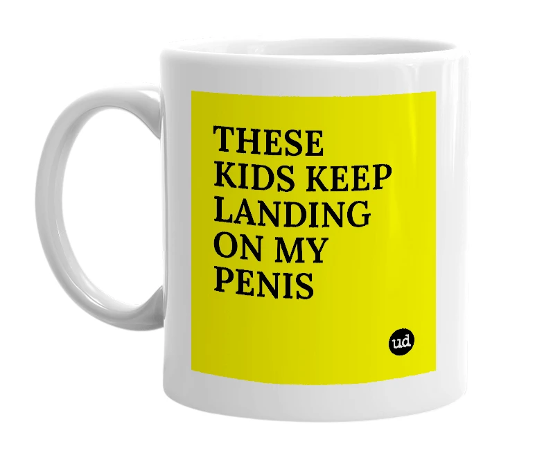 White mug with 'THESE KIDS KEEP LANDING ON MY PENIS' in bold black letters