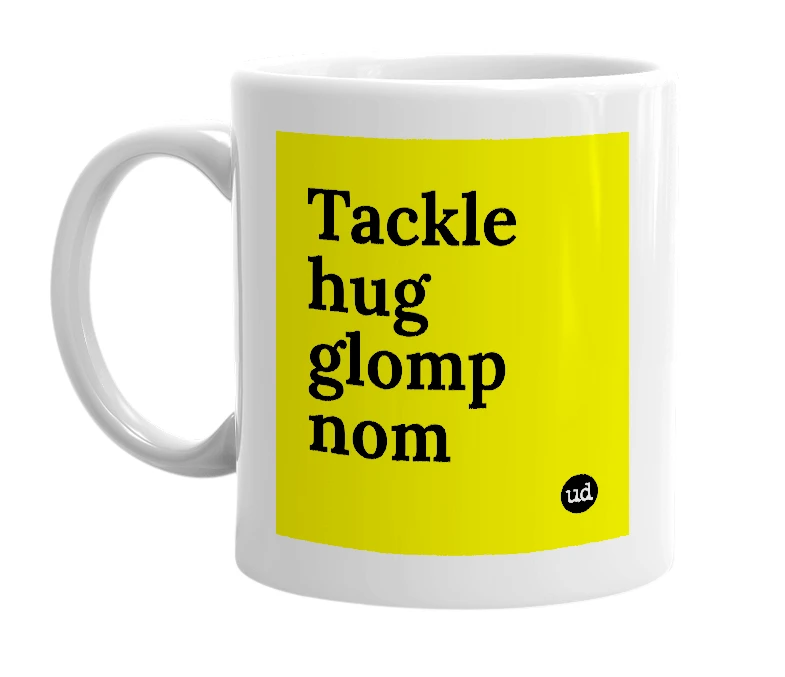 White mug with 'Tackle hug glomp nom' in bold black letters