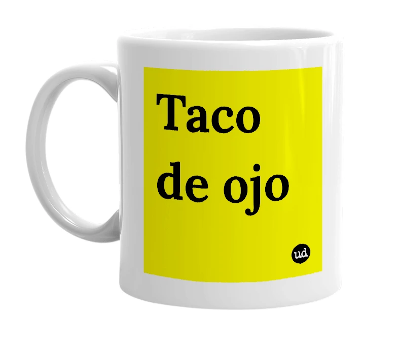 White mug with 'Taco de ojo' in bold black letters