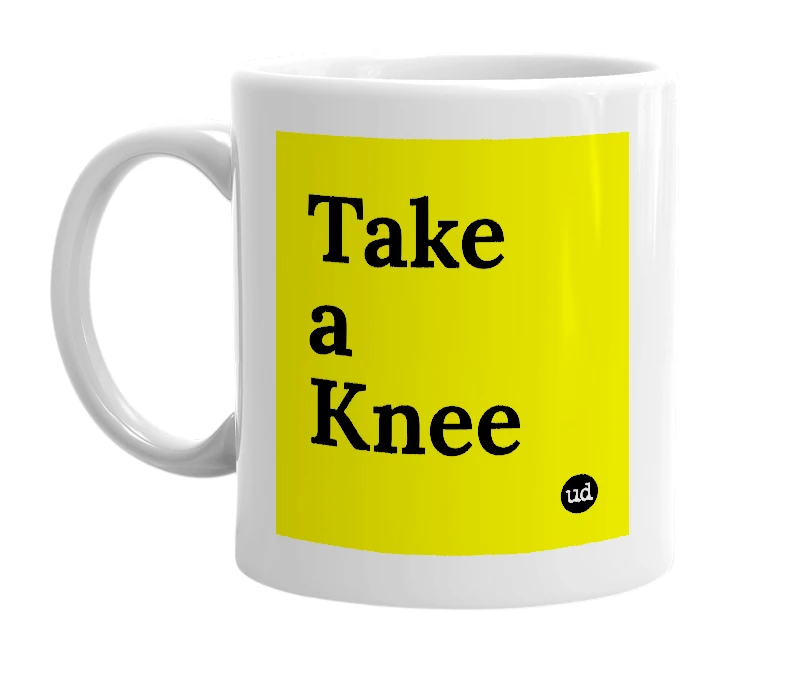 White mug with 'Take a Knee' in bold black letters