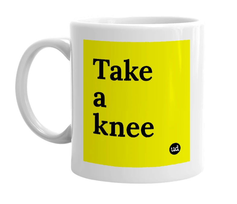 White mug with 'Take a knee' in bold black letters
