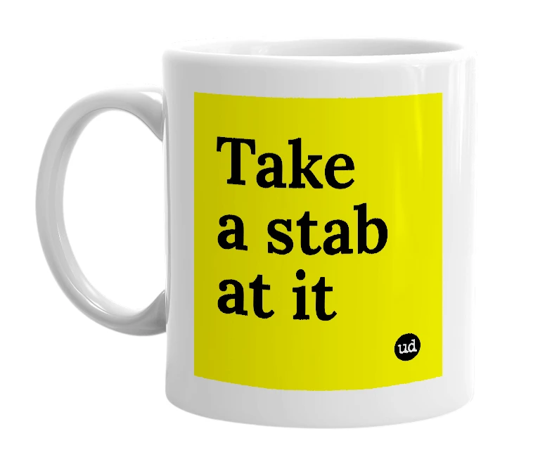 White mug with 'Take a stab at it' in bold black letters