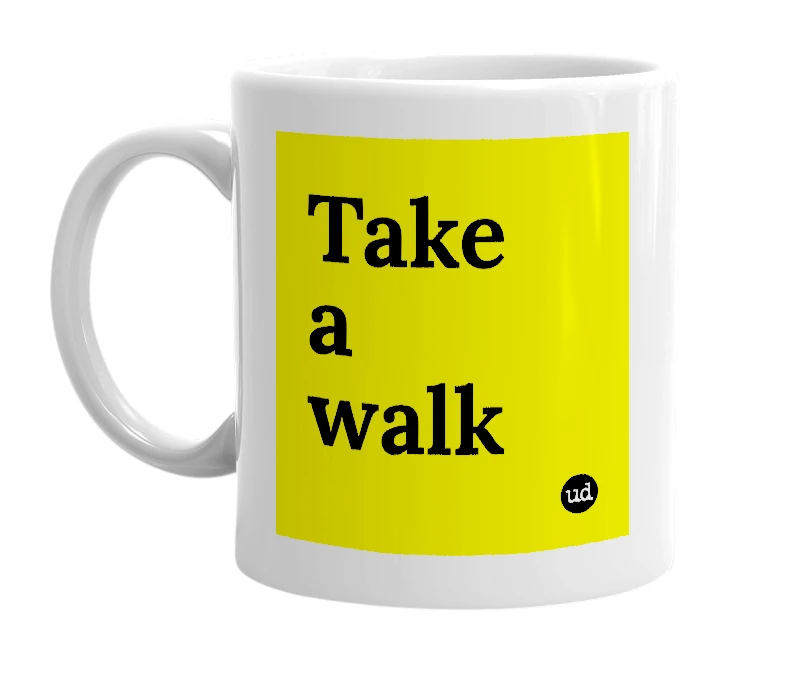 White mug with 'Take a walk' in bold black letters